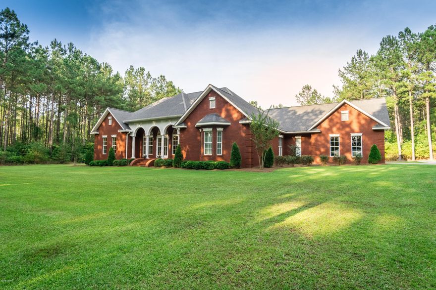 Beautiful Executive Home nestled behind the trees. Custom Brick home, 3 bedroom 2.5 bath with 2nd floor bonus room. As you enter the front of home into the expansive living room and dining room, tastefully done with columns with views through to back of home. With tall ceiling trayed ceiling with cozy fireplace. Spacious kitchen with large breakfast bar and eatin area, open to den. Split bedroom plan with master suite with, 2 walk in closets, double vanities, built in drawers, separate shower, soaking tub. Second bedroom has vanity with sink. Second bath has oversized tiled shower. Large utility room with hanging bars. Upstairs bonus room would make great media/home theater room. Attached 2 car garage along with 20x36 detached carport storage building. Property has private putting green.