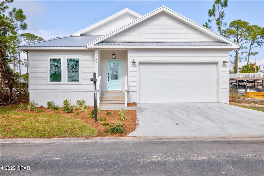 Panama City Beach waterfront with gulf access! Bring the boat and fishing poles! Tons of upgrades to include 2X6 exterior framing, 9ft ceilings, wood soft close cabinets, granite countertops, floor to ceiling custom tile shower, spray foam insulation in the attic, oversized two car garage with 8ft tall garage door, hurricane impact rated windows, concrete board hardie siding, upgraded interior trim package, luxury vinyl plank flooring, hurricane rated front exterior door, Kitchen-aid appliances (stove/oven, microwave, dishwasher) Gas available. HOA includes $150 per month and includes lawn care, two pools, dog park, gated community, basic cable, and trash pickup. When you enter the home you will find a hallway leading.. to the living/kitchen and back deck. The kitchen features, wood cabinets, granite countertops and stainless steel appliances (gas available). The master bedroom is located off of the Livingroom and has a walk-in closet. The master bath has wood cabinets, granite countertops with his and her sinks and a full height tile shower with a glass door. The spare two bedrooms are located off of the hall at the front of the home and share a bathroom with a tub/shower combo and a granite countertop.