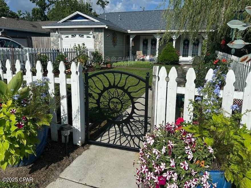 ABSOLUTE ADORABLE WELL CARED FOR FLORIDA COTTAGE IN GROWING CALLAWAY! Right next- door to the Historical Callaway Park Complex. Park has picnic area, Public Rest Rooms, Ball Parks, Tennis Court, Volley- Ball Court, Community Building, kids' playground and Public Boat Launch. Also, a cute Historical school house and museum.
This well-manicured landscaped home has a white picket fence in the front of the home and privacy fenced in backyard.
Find a lovely screened in back Florida room very cozy and private. There is a covered front porch as well and a one car garage for your vehicle. Roof newer in 2020, AC works well but aged, seller providing a full house HOME WARRANTY! Open concept living room, dining room area with stone fireplace. Split floor plan finds Master bedroom and bath on one side and other bedrooms and bath other side. Kitchen is User friendly and houses, Stainless steel appliances with cute shiplap wall and unique antique overhead light fixture.
ALL FURNITURE CAN CONVEY including Washer and Dryer with full price offer or buy separately piece by piece. PAID FOR SOLAR PANELS Convey making your power bill cheap!
Also, the home has Beautiful Pepper Plants, Fruit Trees, all kinds of large potted plants all can stay if desired with good offer. Besides Public water the home offers well water to wash your car, water the lawn and plants free! There are 2 Yard buildings in back. Located just 15 minutes to Tyndall A.F.B. and minutes to many grocery stores, convenient stores, restaurants and much more! This is a rare Gem ready for you to move in and enjoy many years of memories. Don't wait make this Gem your own! Buyer and Buyers agent to verify all dimensions and anything deemed important.