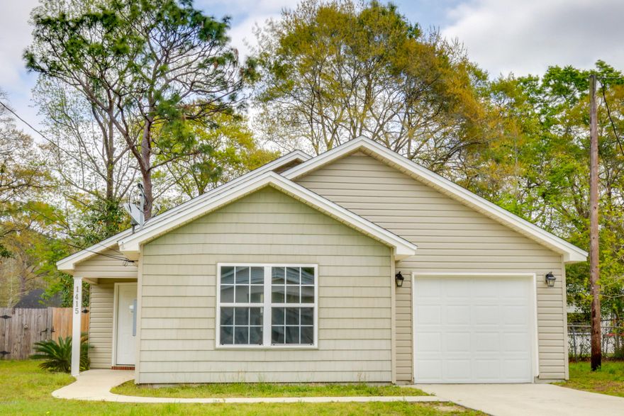 Cute & convenient home in the heart of Lynn Haven.  Living room with laminate flooring & vaulted ceiling opens to the kitchen & dining area.  Spacious kitchen boasts a pantry and long breakfast bar as well as room for your dining table.  The home will be cool and comfortable with a 2.5 ton American Standard HVAC, double pane windows, & ceiling fans throughout.  Freshly painted interior colors are bright & fun - master bedroom has been updated with laminate flooring & two closets.  Two smaller bedrooms have stained concrete flooring. The backyard will be great for entertaining, playing, or grilling with a wood privacy fence & deck for an arbour or fire pit.  Vinyl siding on the home make it easy to care for as well. Call your Realtor today to see this great home & start packing! Measurements are approximate.  If important, please measure.