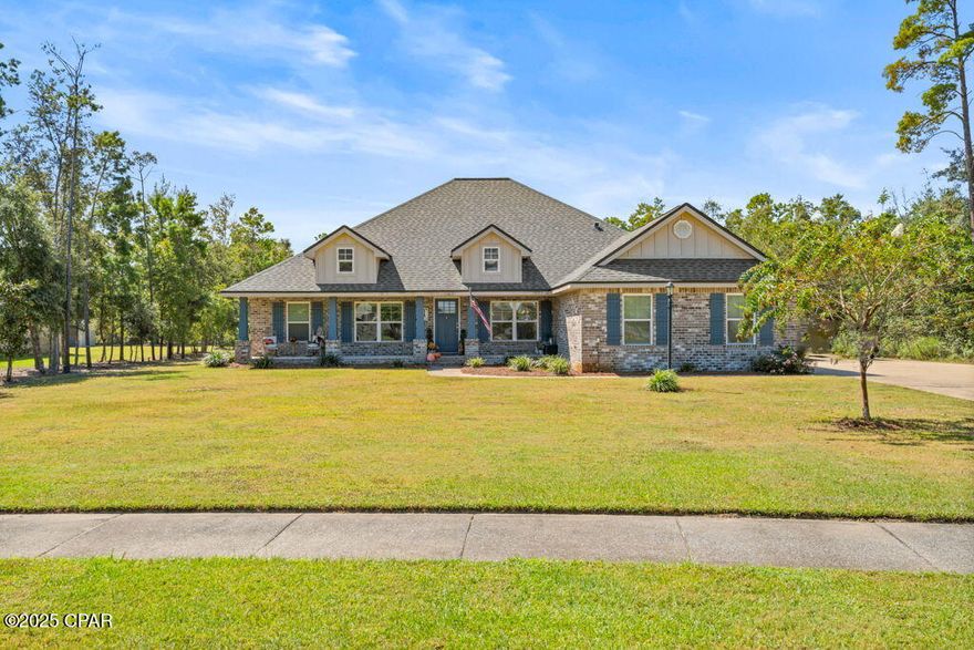 Welcome to 104 Lake Merial Trail! This beautiful 4-bedroom, 2-bathroom home sits on a spacious .58-acre lot in the private and peaceful gated community of Lake Merial. Constructed in 2021, this property is PRICED TO SELL.

The home features a desirable split floorplan with a formal dining room and a versatile office/flex space off the entryway. The kitchen offers stainless steel appliances, white cabinetry, a custom glass backsplash, and an open design that flows into the large living room highlighted by a shiplap accent wall. The master suite includes double vanities, his-and-hers walk-in closets, a separate shower, and a garden tub with custom backsplash.

Enjoy outdoor living with a welcoming front porch, a covered back patio, and a private gunite pool with stone paver surround and fenced backyard. The oversized driveway provides plenty of parking for family and friends, and the property also includes a private well dedicated to irrigation.

Lake Merial is a gated community offering hiking trails, green space, and a spring-fed lake with crystal-clear water perfect for kayaking, paddle boarding, canoeing, and fishing. Conveniently located less than 15 minutes from Lynn Haven and about 30 minutes from Panama City Beach, this home blends privacy with accessibility.

Schedule your showing today—this one won't last!