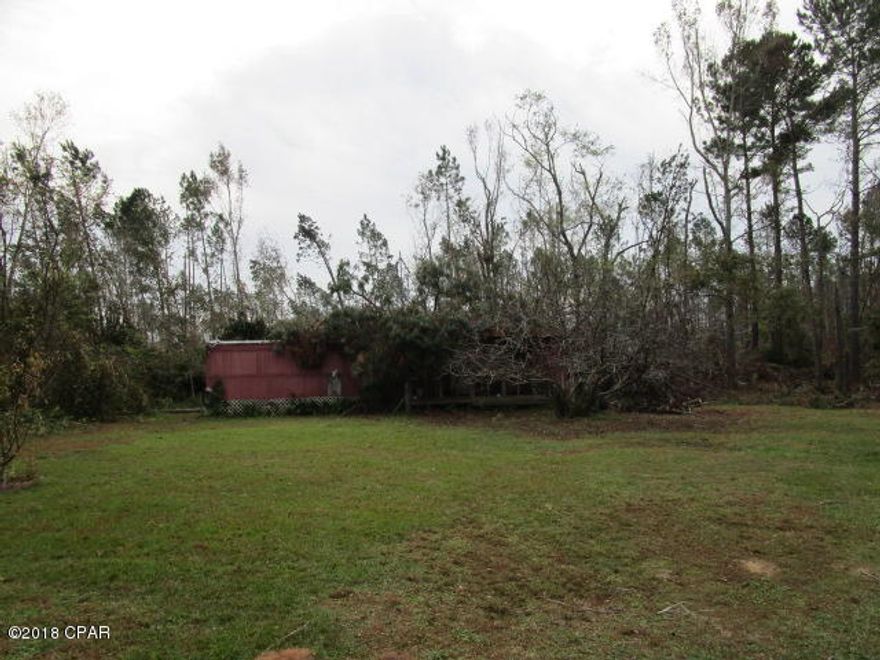 1.4 acres with older damaged single wide.  Power pole, septic and county water in place.  Executor does not guarantee condition of utilities buyer to confirm.  Across from public boat ramp road and a minute from national forest.