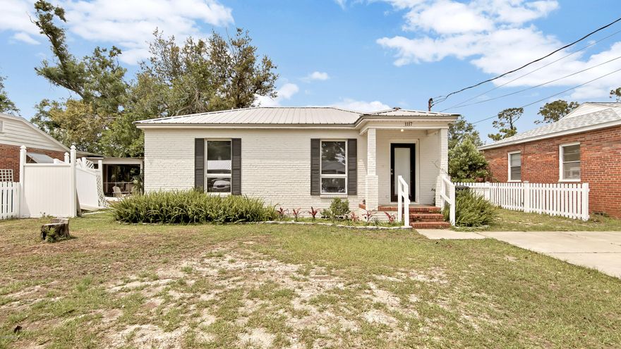 'CURRENTLY UNDER CONTRACT, SELLER ACCEPTING BACKUP OFFERS'  If you like being where things are happening, you will fall in love with this charming brick home in the heart of St. Andrews. Covered front porch. Beautiful wood floors. Built-in book case surrounding back door.  Metal Roof. Good sized bedrooms and a generous bathroom with subway tiled shower. Master bedroom has a sitting/dressing area. Laundry Room. There is a cottage/workshop with metal roof in the backyard which is ready for electric and plumbing.  The large backyard features a cozy fire pit. This delightful property is within walking distance of Oakland Terrace Park, Lake Caroline and St. Andrews Marina. Just a short drive away, you will find the Bay County Library and Bay County Government Center, as well as shopping, dining.  All measurements, ages and room sizes are approximate. Please verify if important.