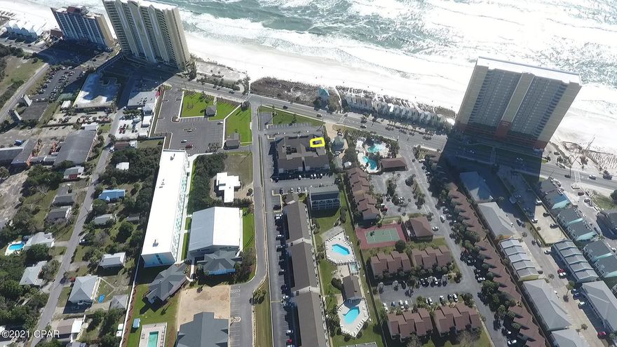 This 2 bedroom condo at Endless Summer is directly across from beach access #70. This condo is only a few steps from the white sandy beach and the pool. This unit comes completely furnished and rental ready.  Tile flooring throughout, with lots of beachy decor. Endless Summer is centrally located 1/2 mile past 79 and Pier Park and has 2 swimming pools, clubhouse, shuffleboard, hot tub and picnic area with barbecue grills. Don't miss your chance to own a piece of paradise!