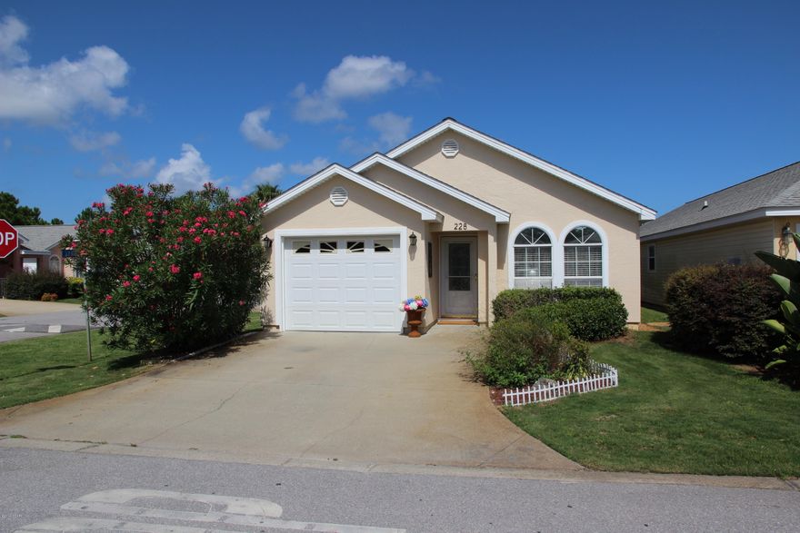 This is a Beautiful home in Palm Cove.  ONE CAR GARAGE.  It is the last home on the street, so it has a large side-yard.  NEW QUARTZ KITCHEN COUNTER TOPS, NEW KITCHEN CABINETRY.  Under cabinet lights, vaulted ceilings, new paint, large laundry room, updated marble flooring in master bath.  Wood floors in living room.  Upgraded counter tops in master bathroom.   Patio in the back of the home.  Storm door.  Furniture can be purchased if desired.  You have to see this home.