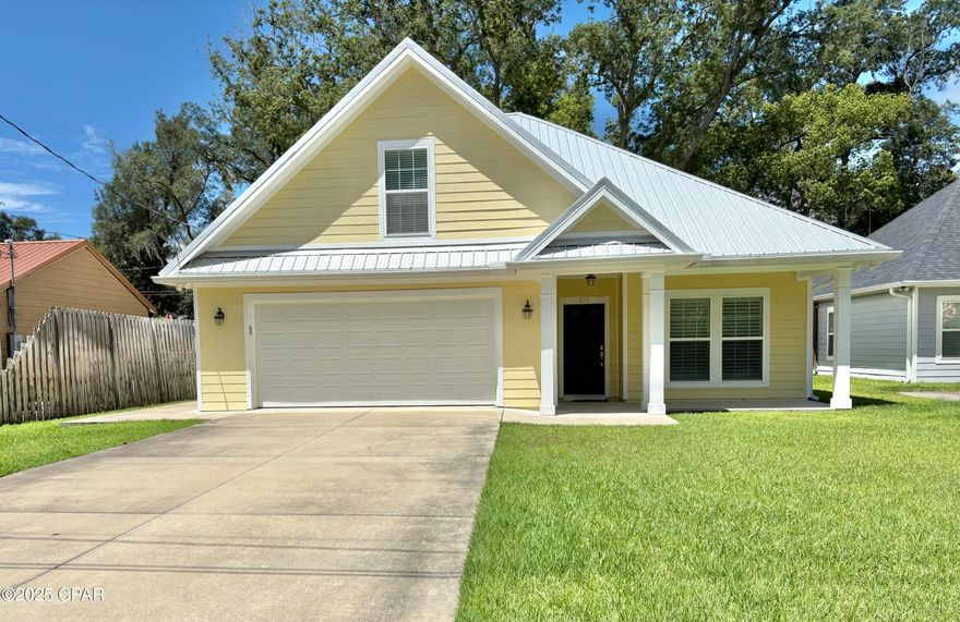 Coastal Charm Meets Turnkey Living
This newer 4-bedroom, 2-bath home in the highly sought-after Cove community offers the ideal combination of comfort, style, and convenience—without the restrictions of an HOA. The open floor plan effortlessly connects the living room, dining room, and kitchen, creating a perfect flow for entertaining or enjoying everyday family life. A separate dining area offers easy kitchen access, while the upstairs 4th bedroom provides flexibility for a guest suite, home office, or media room.

Inside, you'll find modern finishes, a functional layout that balances gathering spaces with private retreats, and an interior laundry room for everyday ease. Outside, the fully fenced backyard provides privacy and a secure space for children and pets, with convenient alley access for parking or storage. A deep well supplies clean irrigation water to keep the lush landscaping vibrant year-round.

Perfectly positioned near Holy Nativity Episcopal School and just a short stroll to the downtown waterfront district, you'll enjoy easy access to boutique shopping, local dining, and the St. Andrews Bay Yacht Club. Sidewalks, alleyways, golf-cart accessibility, and centuries-old oak trees add to the Cove's beloved coastal charm and strong sense of community.

Buyer to verify all data and approximate dimensions if important.