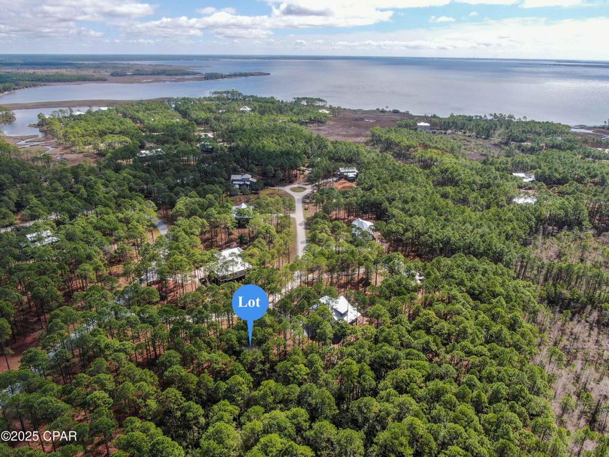 Discover the perfect canvas for your dream home on this expansive .87-acre homesite in the exclusive gated community of RiverCamps on Crooked Creek! Nestled among hundreds of acres of conservation land, this oversized lot offers unmatched privacy and room to build the custom retreat you've always imagined. Architectural guidelines apply—ask your Realtor for details.

RiverCamps is a hidden gem in Panama City Beach—peaceful and tucked away, yet just minutes from the beach, Pier Park, the airport, and top local dining. While the clubhouse, pool, and fitness center are currently being built, residents still enjoy incredible amenities including a private boat launch, access to Crooked Creek, West Bay, and the Gulf of Mexico, and miles of scenic walking and biking trails.

Whether you're looking to build a full-time residence or a private coastal getaway, this unique homesite offers the perfect blend of natural beauty, privacy, and location.