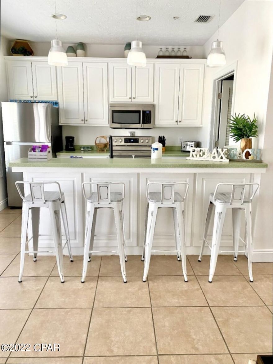 Looking for an affordable turn key short term rental investment? You've found it! Step inside this incredible waterfront condo with serene water views. Fresh paint and brand new furniture! Tucked away along Grand Lagoon that connects to St. Andrews bay and the Gulf of Mexico! A 6 minute walk to the nearest beach access and walking distance to restaurants, theme parks, goofy golf, golf cart rentals and night life. Comes fully furnished with all electronics, linens and kitchen supplies.