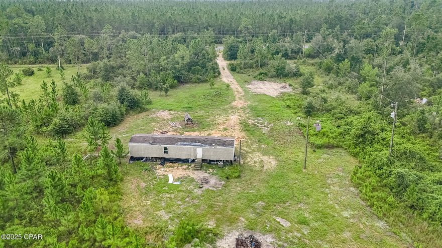 Priced to sell quickly. 5 Acres with Mobile home. 2018 manufactured home with two bedrooms, and one bathroom. 

Well, septic and electric are all in place already and are believed to be functioning as intended

Manufactured Home needs extensive work. No value is attributed to the home. This is a cash only transaction. The property and home is being sold AS IS. 

All information here is believed to be accurate. Buyer is responsible for verifying all facts including measurements, condition etc...