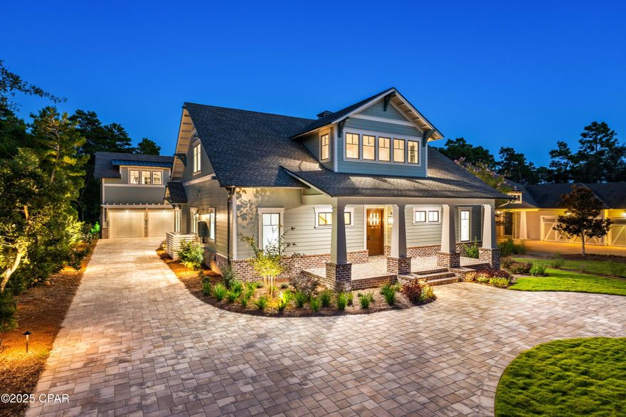 Brand New Construction with Screened-in Pool + Carriage House located on the 10th Hole of Shark's Tooth Golf Course in the coveted Gated Neighborhood of Wild Heron. Masterfully combining timeless elegance with modern design, this craftsman home spans 3723 sqft offering 5 bedrooms + Loft Space, 4.5 bath, and an array of thoughtfully designed spaces tailored for both comfort and entertaining. Outdoors, an oversized screened-in patio and pool area provide a private sanctuary, complete with a fully appointed Outdoor Kitchen with Bar Seating, separate dining space, and outdoor living room centered around a brick gas fireplace. The main level highlights an open-concept kitchen, living, and dining space that set the stage for entertaining. Custom in-set cabinets, quartz countertops, Wolf and

Sub-Zero appliance package anchor the chef's kitchen and Butler's Pantry, seamlessly blending performance and design.
Shiplap walls frame the living and dining areas, where Restoration Hardware furnishings echo the home's refined Craftsman character. Anchored by a gas fireplace, the expansive living room offers a serene and inviting atmosphere, perfect for both relaxation and entertaining. A conveniently located half bath serves the communal spaces, adding both comfort and practicality to the home's design.
Retreat into the sizeable main level Primary Bedroom, equipped with large Anderson sliding doors allowing for ample natural light and seamless indoor-outdoor living. The ensuite resort-like primary bathroom offers a statement garden tub, an elegant shower, dual vanities, and a built-out walk-in closet.
Upstairs, you'll find three large bedrooms, including one with its own ensuite bath, along with a spacious loft that offers a flexible area to make your own. A generous hall bathroom serves the remaining bedrooms, providing both comfort and convenience for family and guests.
The oversized driveway allows for 10+ car parking not including the hidden two-car garage with a spacious carriage house above, offering versatile accommodations for guests, a private office, or additional living space.
Wild Heron is a 734-acre community with Coastal Craftsman Style on the shores of Lake Powell at Inlet Beach, Florida. Located just a short drive from world-class shopping, dining, the World's Most Beautiful Beaches of Panama City Beach, and the ever-popular 30A Beaches of South Walton County. The community offers a plethora of amenities, including a lakeview swimming pool, health & fitness center, boardwalks and nature paths, parks and lakefront Boathouse with kayaks and canoes. Owners at Wild Heron can opt to join the WaterSound Beach Club offering members exclusive access to Shark's Tooth Golf Course, The Third Golf Course, Camp Creek Golf Course, Camp Creek Ammenties Center, and the WaterSound Beach Club for private beach access and its multiple pools and restaurants.