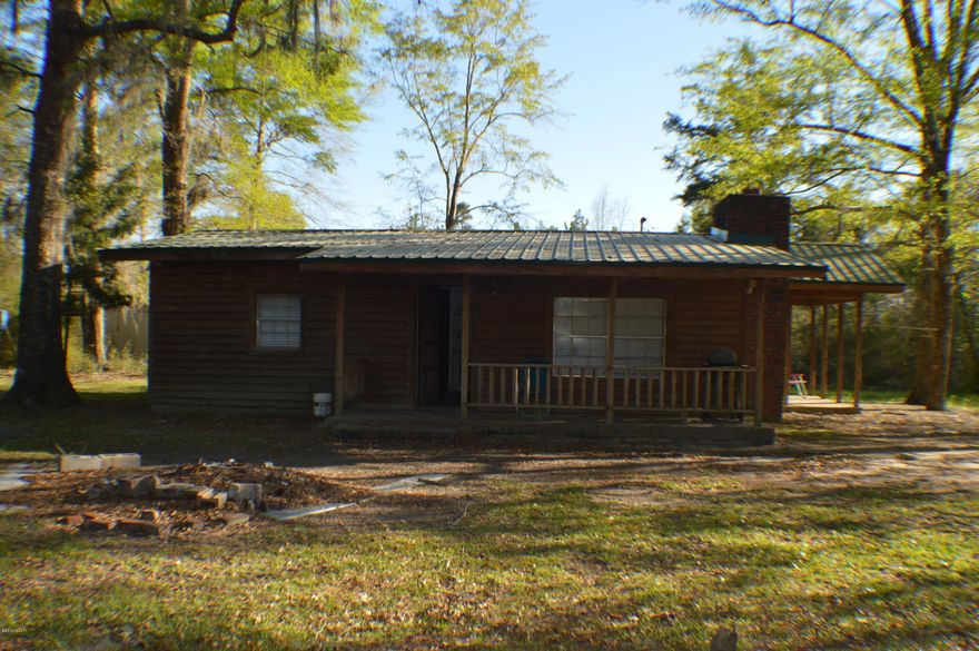 Looking for Privacy...you have found it!!! Cabin nestled under hardwoods sitting on little over 23 acres. Would make great weekend get away, hunting cabin or just place to call home. Minutes from 231 with access to Panama City Beach and International Airport. Minutes from Ecofina Creek....