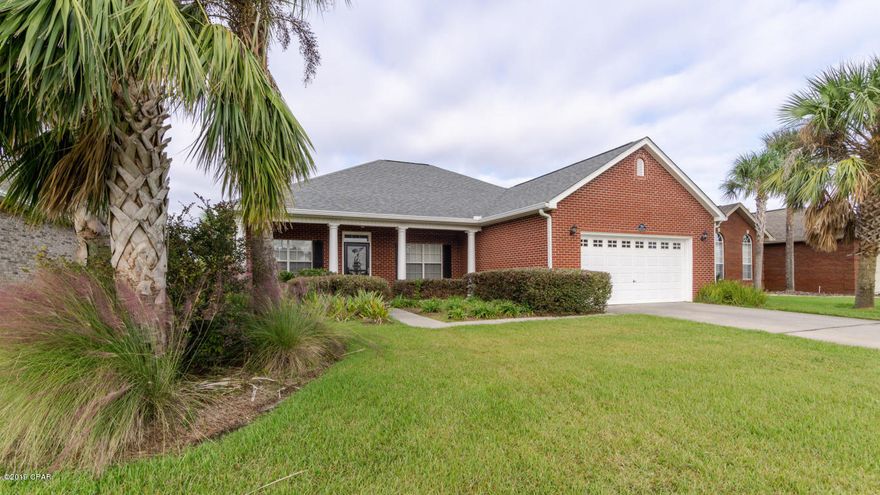 Show stopping, four bedroom home in deed restricted, conveniently located Camryn's Crossing neighborhood, with formal dining room, eat in kitchen with stainless steel appliances, solid surface counter tops and a screened in patio overlooking the private, professionally landscaped back yard.  There is a gas fireplace and the heating system uses gas.  Careful attention to detail, evident in the hand scraped mahogany floors, custom lighting features and more!