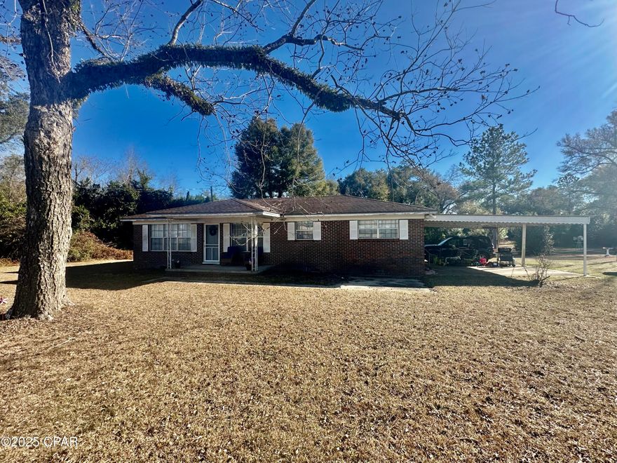 This is IT, your two bedroom two bath BRICK home on two and a quarter acres in north Jackson County on a paved road.  It has an attached two car carport with a very spacious front and back yard.  The Drive way is shared.  It has hardwood floors, tile and carpet.  It has an eat in kitchen and a nice den with attached laundry.  This is a must see.