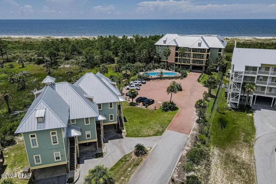 Nestled in the beachfront community of The Club at Cape San Blas, this stunning condo at 160 Cape Pointe Dr offers a luxurious coastal lifestyle. Boasting 3 bedrooms and 2.5 bathrooms, this residence is a serene retreat on Cape San Blas. Upon entering, you are greeted by an open and airy floor plan that seamlessly connects the living, dining, and kitchen areas. The living room features large windows that flood the space with natural light, creating a warm and inviting ambiance. The kitchen has granite countertops, stainless steel appliances, and ample cabinet space. The master suite is a true retreat, with a spacious layout, a walk-in closet, and an en-suite bathroom complete with a soaking tub and separate shower. The two additional bedrooms are generously sized and perfect for guests or family members. One of the highlights of this condo is its outdoor spaces. Enjoy your morning coffee as you watch the sunrise or unwind with a glass of wine as you watch the sunset from your private, screened balcony spaces. Residents and guests of The Club at Cape San Blas enjoy access to a range of amenities, including a community pool and hot tub, perfect for relaxing and soaking up the Florida sun. With a boardwalk providing direct access to the beach, you can easily spend your days swimming, sunbathing, or strolling along the pristine shores. Located on Cape San Blas, this condo offers a serene and secluded setting, yet is just a short drive away from shopping, dining, and entertainment options. Whether you're looking for a permanent residence or a vacation home, this condo at 160 Cape Pointe Dr is the perfect place to call your own.