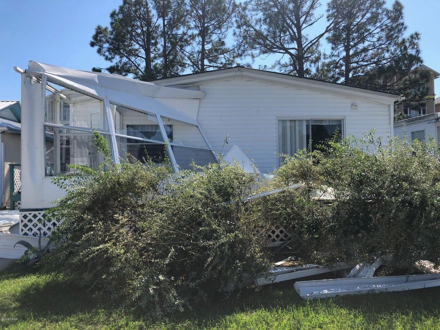 55+ community near the beach! Less than 2 miles to the Sandy Beaches. This unique subdivision has low dues that include water, sewer, trash, cable, landscape, pool and community room. Affordable beach bungalow with lots of space. Carpet and paint needed! With a little work, you will have your piece of paradise. Newer metal roof. No rentals allowed, even long term. Cash only. No residence in the home allowed under 55+.