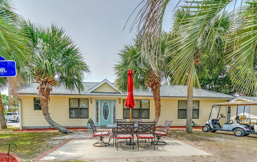 Check out this stunning 3 bedroom, 2 bath home that includes an extra lot. The extra lot gives you that amazing outdoor space making entertaining fabulous.  The floor plan of this home is super open and flows very well.  The large kitchen has a great breakfast bar and is open to the living room. This home has a new roof and has the seller has made recent updates to the interior decor and paint.  It doesn't get better than this! Venture Out is a golf cart community that has 300' on the beautiful pristine beaches of the Gulf of Mexico and 1,000' on the Grand Lagoon. Venture Out has something for everyone. With two pools, fishing pier, boat ramp, mini golf, children's play ground and much more!