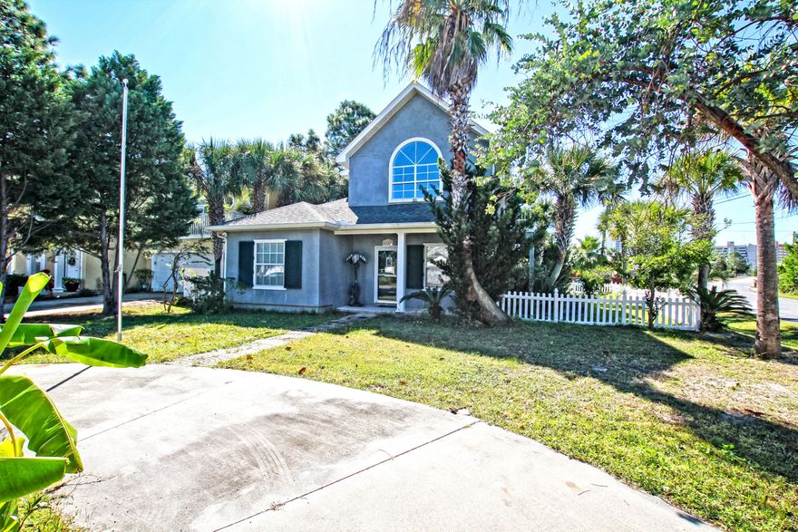 SELLER SYAYS BRING ME AN OFFER! Great location!  Boat launch just a 196 feet from the front yard and 2 more within a quarter of a mile away.  Beautiful eucalyptus tree in the front yard along with majestic palms lining the perimeter.  Property features outside hot and cold shower, sprinkler system, hurricane shutters and can fly our countries beloved flag from the front yard flag pole!  Close to beautiful Saint Andrews State Park, entertainment and restaurants. Come take a look!