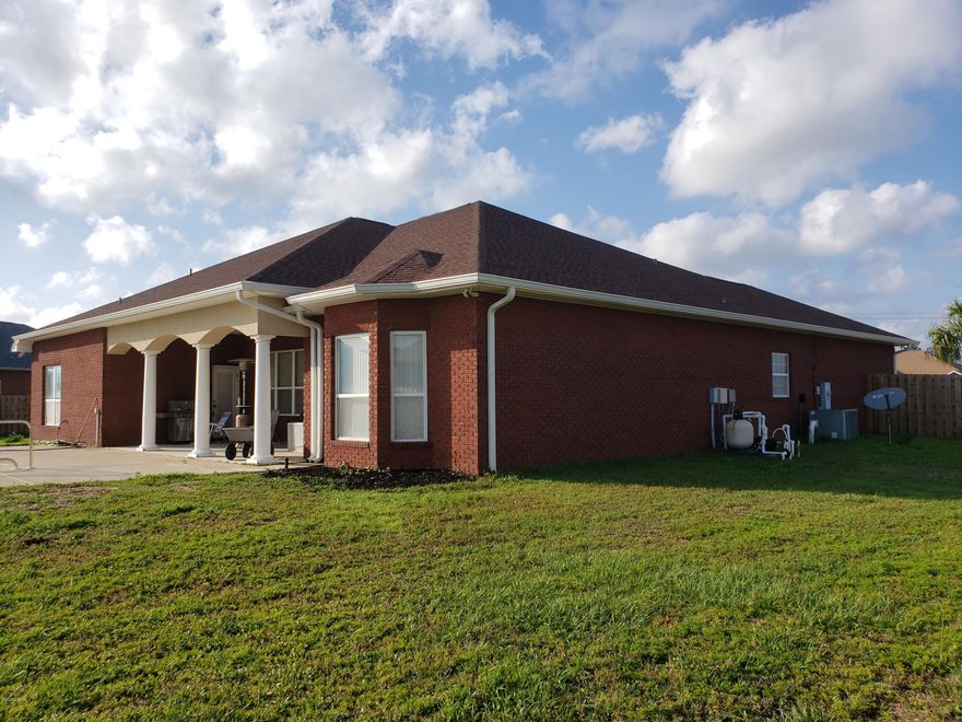 This elegant all brick home has it all. Brand New A/C with a 10 yr warranty for new homeowner & the Nest Thermostat and 4 Room Temperature Sensors. Brand New Samsung 28 cu ft triple french door Refrigerator. New carpet and woodlook tile floors.This house sits on a 1.15 Acre waterfront lot. New privacy fence. Gunite Pool surrounded by beautiful landscaping & lg. palms.Cathedral trey ceilings, crown molding and recessed lighting. This 4 bdrm 3 full bath also has separate office & formal Dining Room.(Custom Arches & Columns front,back & inside) 3 back doors lead to the beautiful & private pool area also covered back deck featuring double ceiling fans & lighting for great entertaining atmosphere day or night. Plus''Ring'' Video DoorBell Pro w motion sensors & Pro Camera & Audio talkback alerts