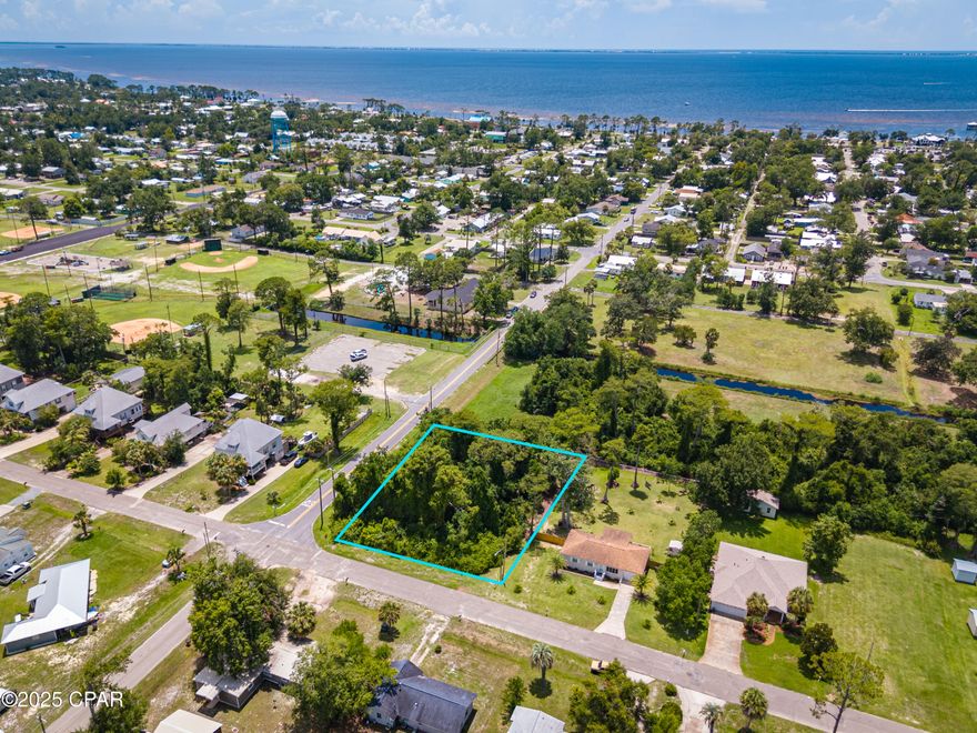 Discover the ideal setting for your new construction home on this impressive 0.49-acre lot in Port St. Joe! A key feature of this property is there is no HOA, freeing you from monthly dues and HOA restrictions. This provides a unique opportunity to maximize your investment and personalize your build on a blank canvas. The location offers exceptional convenience. From your future front door, take a short golf cart ride to watch the beautiful sunsets over St. Joseph Bay before heading to the downtown area for dinner at one of the many locally owned restaurants along with shopping at boutiques. Enjoy easy access to the park, frisbee golf trail, recreation paths, and a community pavilion. St Joe Bay and the stunning Gulf County beaches are also only a short drive. Whether you envision a primary residence, a vacation getaway, or a valuable investment property, this lot provides the flexibility and location for success.
