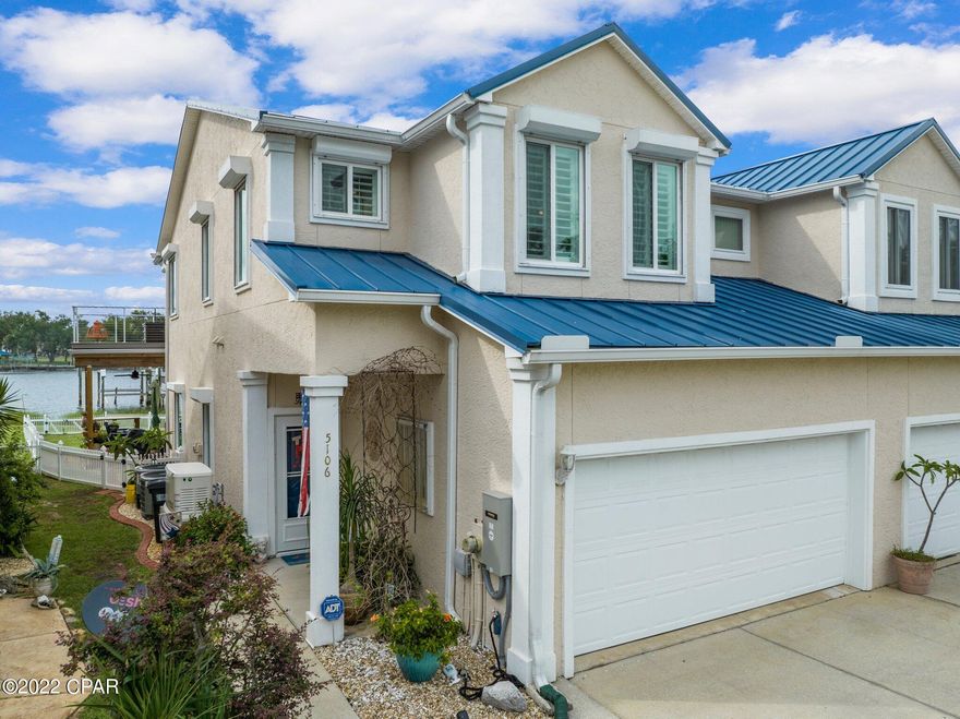 Gorgeous waterfront townhome with assigned boat lift and jet ski lift!  Don't miss this beautiful home just minutes from Tyndall Air Force Base and a quick 15-minute boat ride to Shell Island.  The two story 3 bed, 2.5 bath townhome has amazing water views from the living room, kitchen, dining and bonus room.  The house has been beautifully remodeled to include a new kitchen with Quartz

 countertops, new soft close cabinets with pull out shelves, tile backsplash, copper farmhouse sink, built in wine refrigerator, new fingerprint resistant black stainless steel appliances in 2018, gas stove and custom lighting.  There are tile floors throughout the home. Highlights include a ventless gas fireplace,  wood plantation shutters throughout, all new thermal windows throughout home, new 40 year throughout, all new thermal windows throughout home, new 40 year metal roof, new downstairs sliding door with built in blinds, 2 new HVAC systems in 2018, new water heater in 2019, fully re-painted inside and out.  Electric hurricane shutters are installed.  A Generac whole house gas generator is in place.  A half bath is downstairs. Great storage under the stairs.  Downstairs is an open floor plan with lots of light coming into the living room/dining room/ kitchen area.  Upstairs are two guest bedrooms.  The second bedroom has a bonus 10 x 12 area perfect for a reading nook, the expansive master bedroom has a 10 x 20 bonus room off of it perfect for a home office.  The master bathroom has a soaking tub, two vanities and a walk in shower.  There are barn doors for the bonus room and master walk in closet.  The outdoor spaces are the highlights of the house.  The new upstairs deck is a great place for evening cocktails, dolphin sightings and catching the gorgeous sunsets!  The downstairs slip resistant textured deck is a great place to lounge in the two chair swings, cookout, sit at the bar that is the length of the deck and enjoy watching the boats going by.  There is a shade to pull down at the heat of the day.  The backyard is fenced in for dogs with a double gate so the lawn maintenance crew can still get in to mow.  There is a rack system to hold kayaks.  The boat lift motor was replaced in 2019. 
 The property line extends to the water and there is an area to put in kayaks as well as a bridge to enter the water on foot.  The best part of living on the water is that there is a large HOA owned dock.  The water is 8-9 feet so it can easily handle most average boats.  The dock was rebuilt after the hurricane and has power, water, lights, ladders and a fish cleaning station.  You can even jump into the water from the dock for a swim.  The HOA fee is currently $150/month (going to $175 in August) and includes all lawn care for the homes and common areas, trash pick up, sprinkler systems for the community, electric to the dock and the dock maintenance.  The location is close to Pier 98 Marina to gas up the boat and get bait.  Rodeo's Steakhouse restaurant is within walking distance.  Many of the neighbors are military or retired.  The property is in an AE Flood Zone so flood insurance is required by lenders.  The seller has a survey and elevation certificate. The seller currently pays $630/year for flood insurance.  Homeowners is $1512/year.  There is guest parking at the entrance to the neighborhood and at the end of the complex.  There are no restrictions on rentals so the property could be used for short term rental.  Make your appointment to see this gorgeous, hidden gem today!