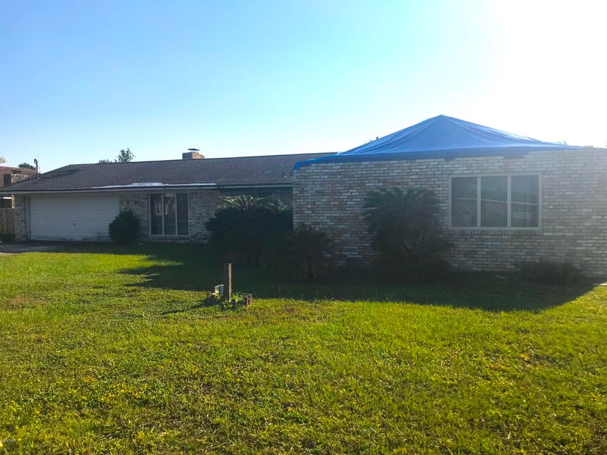 AMAZING fix & flip or investment opportunity to own this large 3 Bedroom / 2 Bathroom BRICK HOME off State Avenue in Panama City! This home is 2,106 sqft. (heated) and 2,734 sqft. (total) with a HUGE DETACHED GARAGE in the backyard, as well as IN-GROUND POOL! The lot for this property is massive! Inside you have a working HVAC system, great floorpan with 2 living rooms, master bedroom with attached office, and an oversized 2-car garage. The home did have some roof damage on the right side, which is over the master bedroom and bathroom. This home will need some roof repair, drywall, etc., as well as some roof repair to the detached garage. Better come see this one quick because IT WILL NOT LAST LONG AT THIS PRICE!      ----- CASH BUYERS ONLY -----