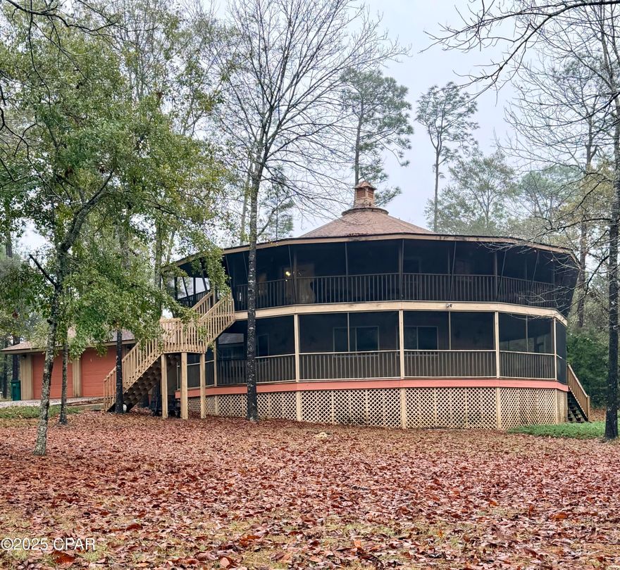 CURRENTLY UNDER CONTRACT, SELLER WILL CONSIDER BACKUP OFFERS

A truly one-of-a-kind 14-sided custom home! Potential Air BnB!!

This distinctive property offers 3 bedrooms and 2.5 baths with a layout designed for both comfort and character. The wrap around screen porches on both floors make this feel like a mountain home getaway right here in Jackson County. 



The main living level (2nd floor) features the living room, kitchen, dining area, and the primary bedroom with its own bathroom.



The 1st floor provides exceptional space with 2 additional bedrooms, a full bath, two separate living areas, and a large utility room.



An elevator and staircase conveniently connect both levels.



Special features include:

• Recessed lighting on both floors

• Propane fireplace

• Vaulted ceilings on the upper level

• Ceiling fans throughout

• Wraparound screened porches covering ¾ of the home on both levels — perfect for relaxing, games or entertaining!



The home sits just outside the Marianna city limits on a quiet, paved street.



You won't find another property like this — schedule your appointment today!