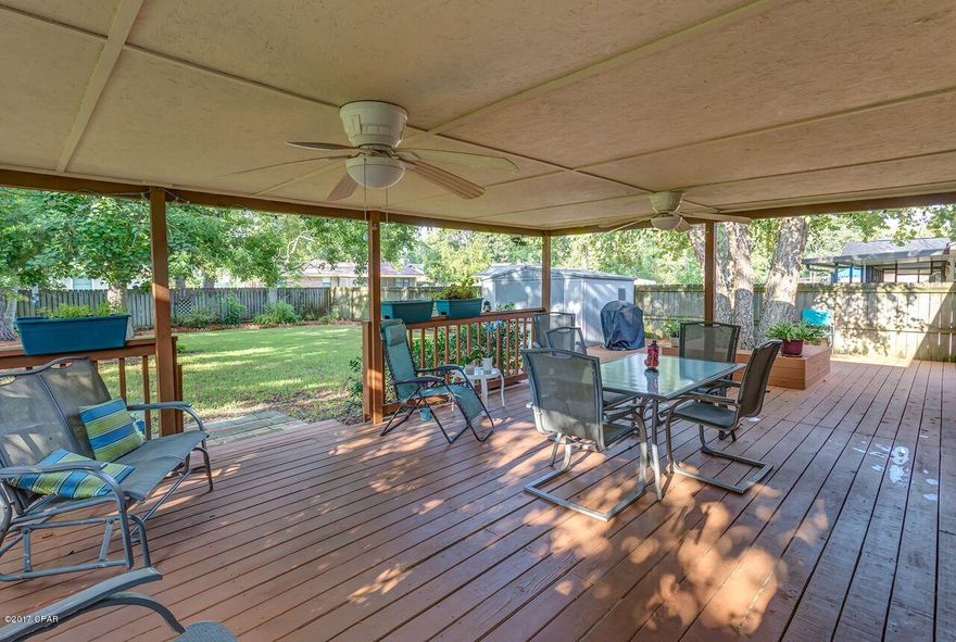 Imagine yourself relaxing on this incredible deck while your children play in the fenced in back yard. 6019 Ivy Dr. is the least expensive 5 bedroom home (over 2000 sq ft) within 5 minutes of the Tyndall main gate! This is the home you and your family have been waiting for!

Existing roof is 18 years old, seller will provide 10,000.00 credit to replace.

Generous sized kitchen with breakfast bar with family gathering spot with wood burning fireplace. This space flows into a formal dining/living space. 4 bedrooms and 2 baths including master on the main floor and a perfect teenage space or 5th bedroom on the second floor. This space was used as an office but has a closet so it is easily a 5th bedroom. Need another bath? It looks like you could easily add one on the 5th bedroom. The home has good storage, a two car garage, low maintenance brick with vinyl trim. This home was loved by it's family for many years, one look and you will love it too! The Bay County Property Appraiser only considers this a 4 bed 2 bath but the flex space on 2nd floor does have a closet. Some of the furniture is negotiable in the sale.