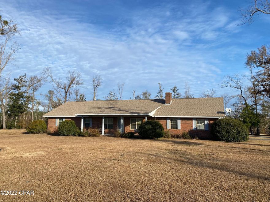 Dreaming of country living?  This well maintained 3 bedroom, 3 bath brick home sits on 7 acres just outside of town.  The open floor plan offers a great room with a wood burning fireplace that has a buck stove insert.  The kitchen features stainless steel appliances, solid surface counter tops, lots of cabinets and a huge breakfast bar!  Bonus room has lots of windows that overlook the back of the property.  Master suite has his & hers closets!  Large laundry room.  New roof and HVAC in 2019.  Rinnai water heater.  Backup Generator.  Bridge Creek flows through the NW corner.  This property is a rare opportunity to own land in the country, yet be close to town.  Come enjoy country living at its best!