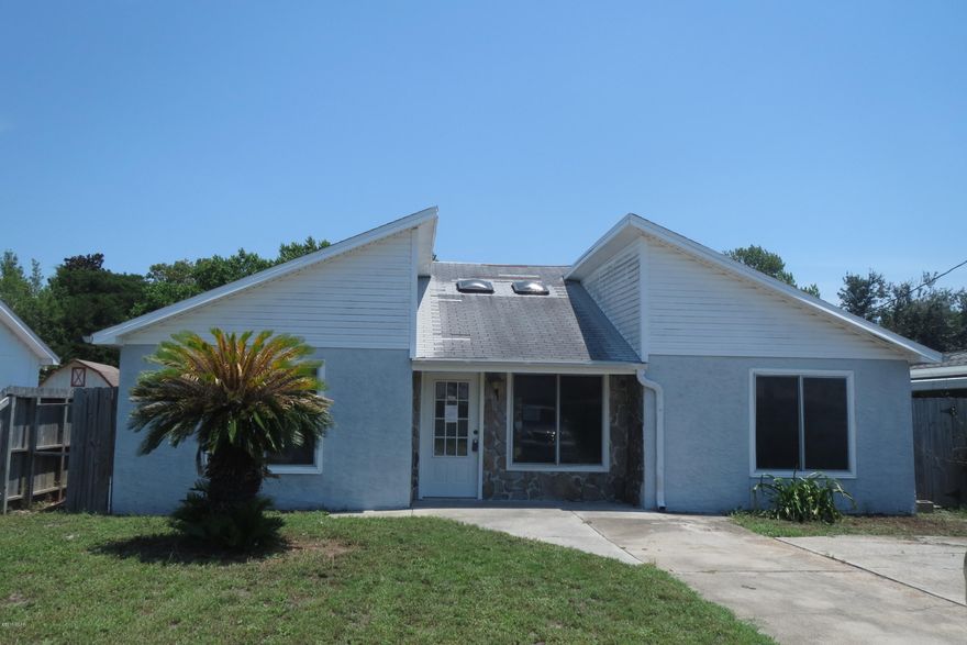 ATTRACTIVE HOME IN THE DESIRABLE OPEN SANDS SUBDIVISION!  Located within walking distance to the Gulf, this home features a spacious living room with vaulted ceilings, a large kitchen with an eat-in dining area and French doors to the open patio from both the living and dining areas.  Home is being sold in its AS IS condition.