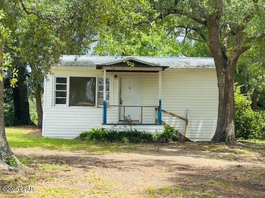 MULTIPLE OFFERS - BEST OFFERS DUE BY 06/09/25 AT 5:00 PM.  Cash buyers only! This AS-IS country charmer sits on a beautiful 1-acre lot shaded by mature oak trees. With tons of potential, it's perfect for a fix and flip, rental, or your next home. The spacious yard offers room to grow, garden, or the opportunity to enjoy rural living.  Don't miss this affordable opportunity to bring your vision to life!