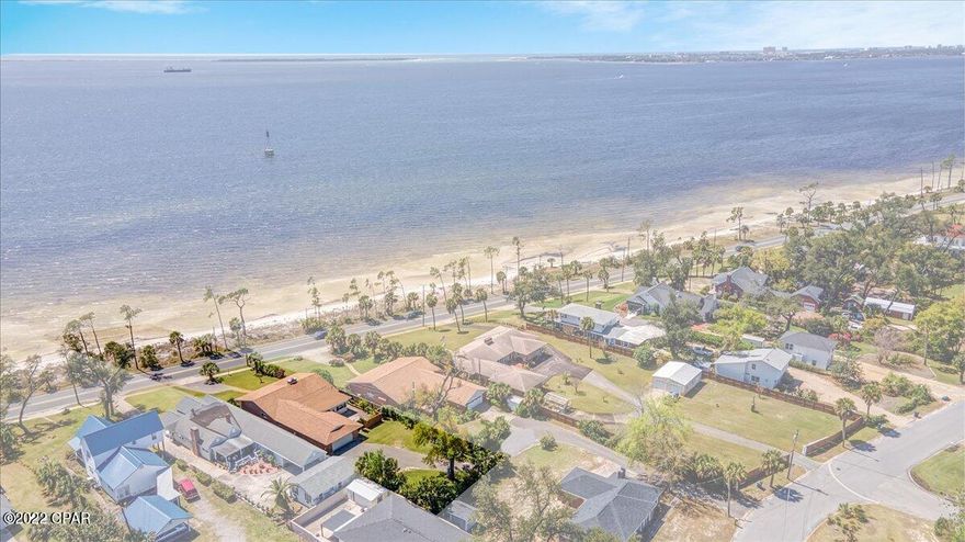 Wonderful home located on picturesque W. Beach Drive in Panama City with a view of the bay and your own deeded beach across the street.  Many updates were done on this home this year including new ductwork  with new supply diffusers, new insulation (old insulation removed), new doors, new garage door, new double pane windows, recessed lighting in some rooms, new cabinets and granite countertops in kitchen, laundry room and sun room with all rooms recently painted. New sprinkler system timer with many new heads, deep well for irrigation with new pump and new pump cover. Master bedroom has two walk in closets, other two bedrooms feature one walk in closet each.   Additional parking in the backyard with enough room to build a mother in law 's quarter or a swimming pool. It is a must see!