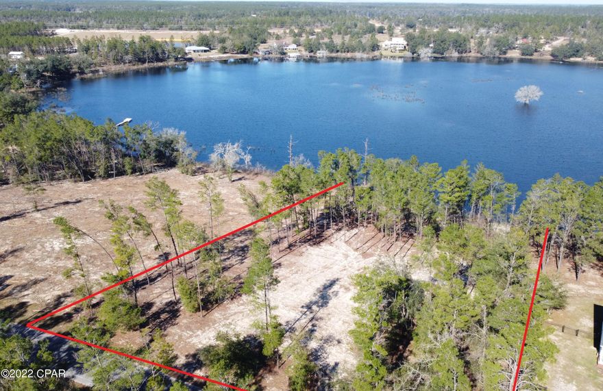 New to the Market! Spectacular Lakefront home site with 162 feet on Piney Lake. Just over 2 acres! Beautiful area featuring plenty of custom built homes. Excellent proximity to Lynn Haven, Panama City Beach and the airport. Pine Ridge Dr is paved and offers underground electric. Crystal clear waters, great for all kinds of water activities. If you are searching for a Lakefront home site this is a must see!