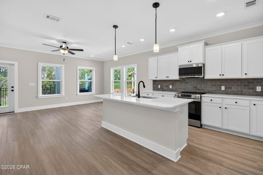 NO RENTAL RESTRICTIONS!!! Our stunning pool is NOW OPEN! The prefect place to SOAK UP THAT Florida SUN! Seagate at Clara is a new townhome community nestled in the vibrant city of Panama City Beach, FL. This two-story unit features board and batten exterior and covered entries. One car garage provides a great space for storing beach essentials. This open concept townhome boasts a stylish kitchen with white cabinets, tile backsplash, a large island with quartz counter tops - perfect for entertaining.  The elegant Owners Suite is designed with comfort in mind showcasing a large walk in closet and double- bowl vanities. Main Bath has tiled shower.  All bathrooms have quartz countertops.  LVP is located throughout the home.  The community pool features a cabana, lounging, seating and grilling stations. This community has a dedicated dog park. Seagate at Clara is in a prime location, approximately 1.4 miles to the sandy beaches and just minutes from Pier Park.