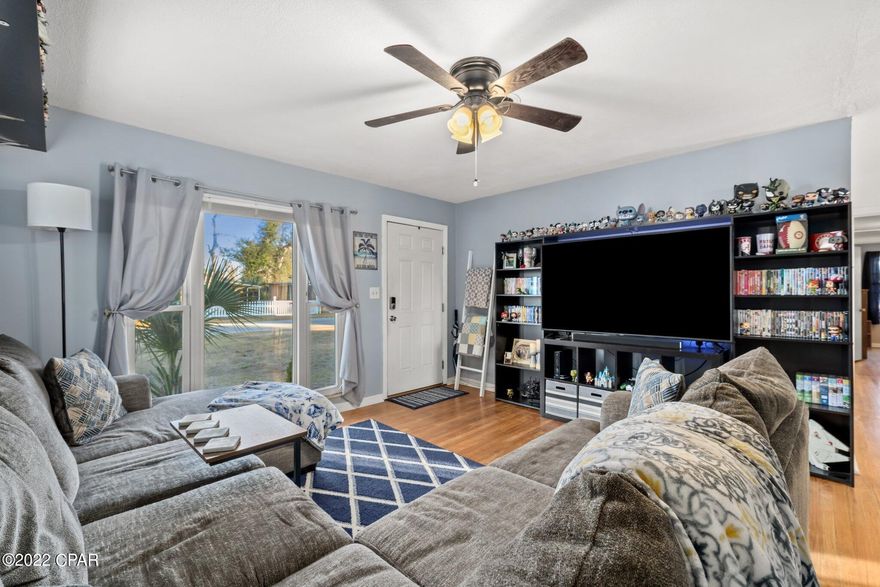 CURRENTLY UNDER CONTRACT, SELLER ACCEPTING BACKUP OFFERS This charming 3 bedroom home is a must see! This move-in ready home has beautiful hardwood floors throughout the house with a large bay window in the living room allowing the house to fill with natural light. There is a very large bonus room/fourth bedroom that sits just off the living area. As you make your way into the kitchen you will notice the beautiful porcelain tile flooring that has recently been installed as well as the new Edison lighting fixture. The refrigerator, dishwasher and microwave have all been updated within the past few years.  The living room, kitchen, dining room, and bathroom have been painted within the last year. The spacious bathroom has an updated vanity and shower head. The laundry room has recently been updated with a very comfortable and unique Cork Flooring.
You will also have a Nest learning thermostat, Ring doorbell and an indoor Ring camera. This house also has a brand new roof that was added in August of 2018.
There is ample storage space inside the home as well as a shed in the backyard. Enjoy the fully fenced in backyard while entertaining guests around your cozy fire pit! You'll also appreciate the short drive to shopping, restaurants and Tyndall Air Force Base. 
Washer and dryer convey with the sale of the home! The pool and pool table is negotiable if the buyer is interested in keeping it at the house.
Contact your Realtor to set up a private showing and get a full list of all the updates.