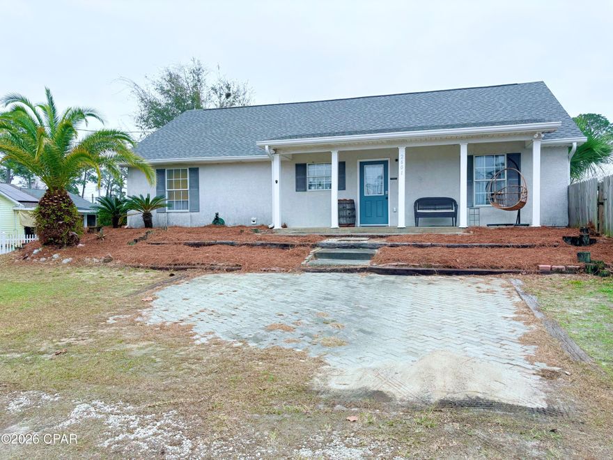 Enjoy everything the desirable East End of Panama City Beach has to offer - just minutes from your doorstep!

Step inside this beautifully maintained 3-bedroom, 2-bath home and discover a bright, open floor plan highlighted by a spacious living area with vaulted ceilings. The generous kitchen features ample counter space, a pantry, breakfast bar, and a large dining area that's perfect for entertaining family and friends. Luxury vinyl plank flooring flows throughout the entire home, creating a seamless, light and airy feel.

The spacious primary suite offers a large walk-in closet and a private en-suite bathroom for your comfort. Two additional bedrooms are well-sized with plenty of closet space and share a full bath, making this layout ideal for families, guests, or a home office setup.

Step outside to enjoy privacy-fenced back and side yards, along with a convenient storage building. An added bonus - the extra side lot is buildable, with sewer available, offering exciting potential for expansion or investment.

Nestled in a quiet neighborhood yet just minutes from local schools, the beach, and Naval Support Activity Panama City, this home delivers both convenience and tranquility.

Don't miss this opportunity to own a low-maintenance, move-in-ready home in one of PCB's most convenient locations!

All information is approximate and should be verified by buyers if important.

{ALL window treatments DO NOT convey.}