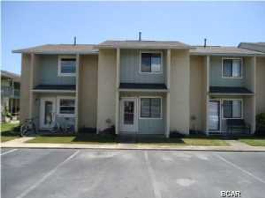 Age, SF, and dimensions approximate. Recently redone inside with new cabinets, countertops, tile downstairs. Unit backs up to tennis courts and heated pool area. Complex has 11 pools to include a clubhouse with pool on the beach. New roof just put on in May. Pets welcome.