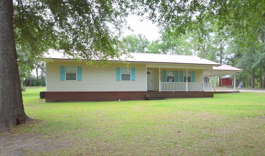 Located in the highly desirable Nearing Hills area this 3-bedroom, 2 bath open floor plan has undergone many renovations to include new metal roof, HVAC, hot water heater, stainless steel appliances, wood look tile flooring and refinished cabinets. Other features include master bedroom with attached bath, office nook and attached carport. Enjoy your time outside on the recently added back porch, in the above ground pool or working under your 36x32 pole barn. House is situated on 1.5 acres, walking distance from schools, restaurants and shopping.