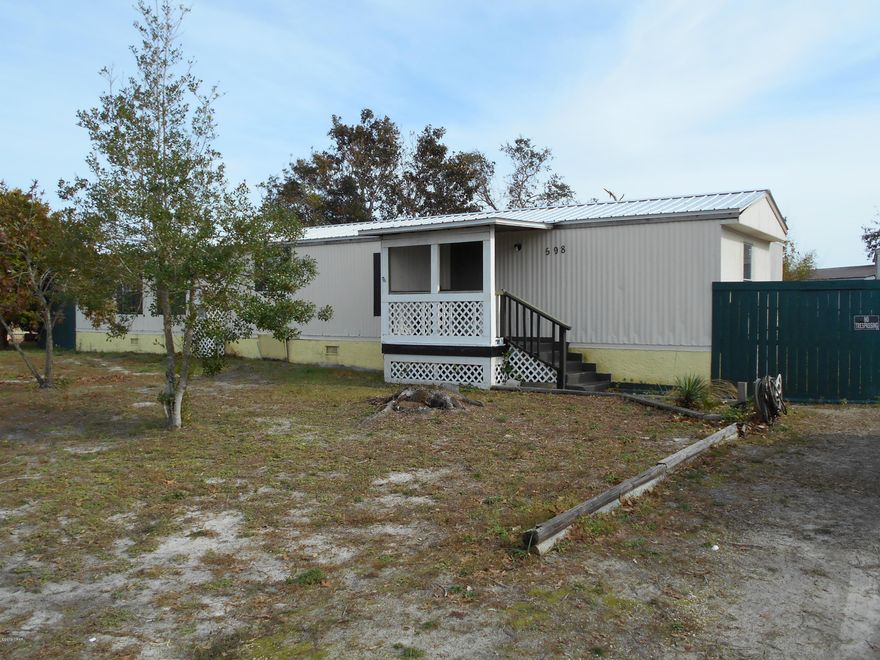 Calling all investors. This 2 bed, 2 bath home needs lots of work, but is a diamond in the rough. Home had a new metal roof, prior to storm, and new AC Feb '19. Interior has been gutted down to the bare studs, and walls have new spray foam insulation to help save on the electric bills. There's even a 13x12 addition on the back (not included in the sq. footage) that could be a 3rd bedroom or mother in laws suite. Home needs a small amount of plumbing and electrical, and all sheetrock, flooring, and cabinets. Contractors estimate is approx. $12k to finish. And then, VOILA!, a mostly new home. Large fenced back yard includes a 25x16 out building. Out building appears to have some plumbing and electrical done, and has a lot of potential. All meas. approx.