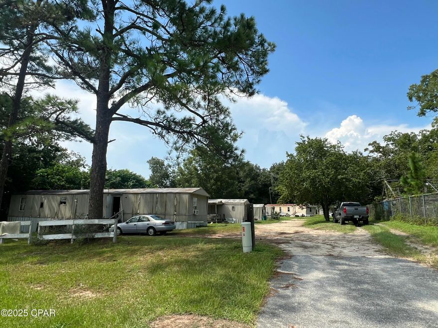 6 unit mobile home park located in Bonifay, less than an hour drive to Panama City Beach. This is a great opportunity for an investor to renovate homes and maximize the rental income or sell the homes and collect lot rent. Bonifay is consistently increasing in population and has great demand for rentals. All homes are on well and septic and individually metered for electricity. Located on Hwy 90, this location gives tenants quick access to Chipley, Marianna, or Defuniak Springs or be in Panama City Beach in under 1 hour. One home is tenant owned paying $450/mo lot rent, three homes are on a rent to own contract paying $450/mo lot rent each with a combined $126/mo in financing. There is another tenant renting for $300 per month for a total monthly rent revenue of $2,226/mo. 1 park owned home is currently vacant and could easily be renovated or sold to generate additional revenue. The owners of the property are licensed real estate agents.
