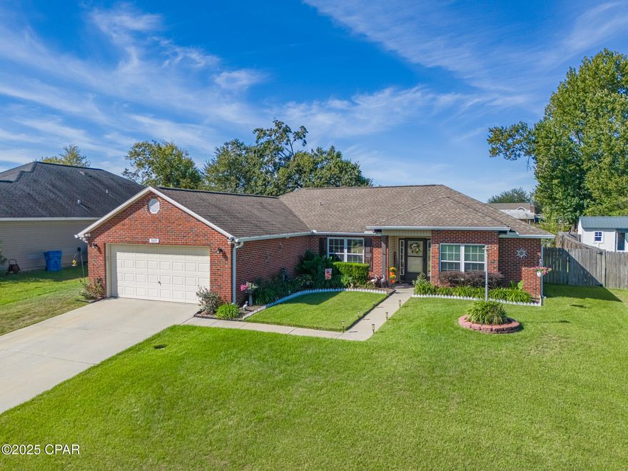 $10,000 in FLEX cash offered from the seller! Use this incentive to go towards closing cost, buy down your interest rate or make upgrades to you new home! Welcome home to this beautifully maintained 3-bedroom, 2 bath residence built in 2005, featuring a desirable split floorplan and stunning lush landscaping that enhances its inviting curb appeal.

Step inside to a spacious living area highlighted by a vaulted ceiling and a cozy wood burning fireplace, opening seamlessly to the dining area perfect for gatherings and everyday living. The primary suite boasts a tray ceiling, while the freshly painted interior and tall front entry door add a modern, welcoming touch.

Enjoy outdoor living on the screened-in back porch overlooking a large, privacy fenced backyard. The property also includes a 10x12 storage shed, sprinkler system, and durable brick and vinyl siding for low-maintenance living.

Conveniently located within a short drive to Eastern Shipbuilding, Tyndall Air Force Base, and Downtown Panama City, as well as Harders Park, Bay Dunes Park, and the beautiful beaches of Panama City Beach and Mexico Beach. Plus, you'll love being close to the new Lindsey's Crossing Shopping Center, featuring Publix, McDonald's, Starbucks, UPS Store, and Circle K for all your daily needs!

This home offers the perfect combination of comfort, convenience, and charm ready for you to move right in!