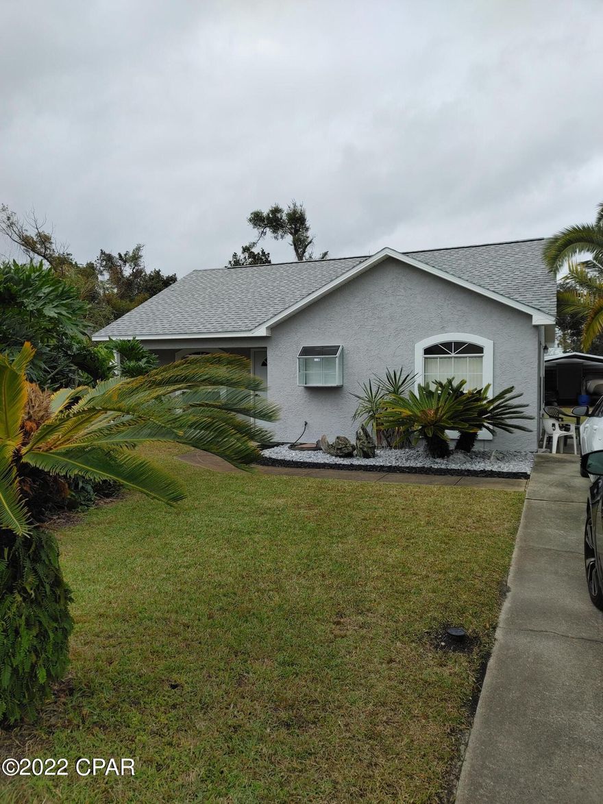 Nicely renovated home in popular St. Andrews with incredible landscaping, curb appeal and fruit trees. Home features 2 brms, 2 full bathrms, List of NEW items includes: LVP flooring, baseboards, interior and exterior paint and sealing, window inserts, screens, bathroom vanities, toilet, master shower, hot water heater, stainless refrigerator and stove, vent hood, fixtures, knobs, exterior doors, ceiling fans with remotes, lighting & smoke detector. A/C and thermostat are 8 years old, roof and dishwasher are 3 years old, privacy fence is 2 years old. House has a 12x16 shed and a double carport, lawn pump and an alarm system through ADT. Stove will arrive on Jan 22nd. The safe in the second bedroom and boat in the carport do not convey and will be removed prior to closing. PRISTINE CONDITION