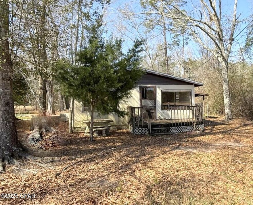 Investor special! This 2-bedroom, 2-bath home is in need of extensive repairs but offers incredible potential for the right buyer. Whether you're looking for a fixer-upper to transform into your dream home or an investment opportunity, this property is full of possibilities. Situated just minutes from town, you'll enjoy the convenience of nearby shopping, dining, and amenities while still having a sense of privacy. With the right vision and renovation, this could be a fantastic home or rental property.