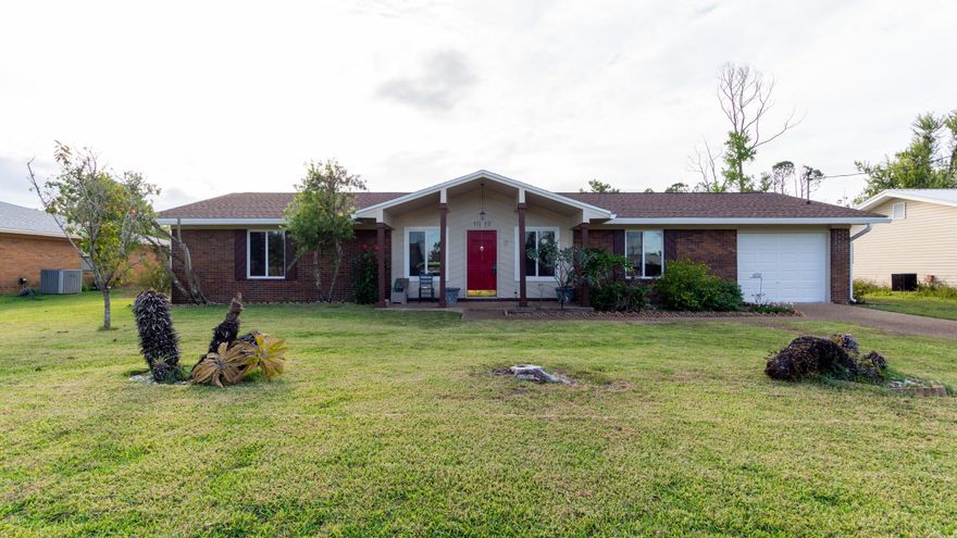 LIKE NEW - Everything in this home has been completely redone so it's like buying a brand new home. All rooms are spacious with neutral colors with a rich wood brown laminate flooring. The kitchen has plenty of room and features a gas stove top, stand alone oven, refrigerator and double bowl cast iron drop-in kitchen sink. Living room is open to the kitchen with wood burning fireplace as a main focal point. Master bedroom features a private master bath with dressing area. Again everything in this home has been replaced down to the stud. It's practically new.