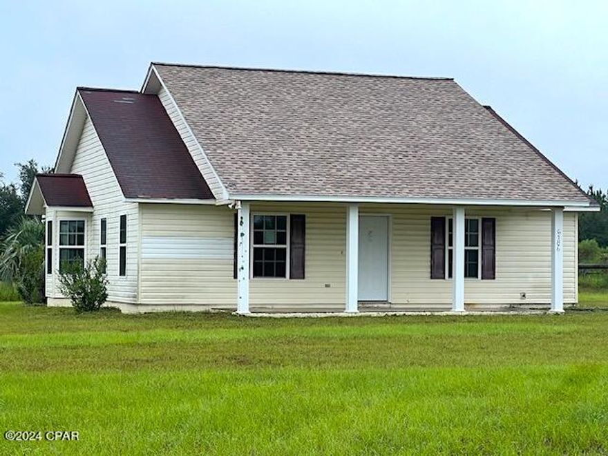 This home is located on a 5 acre parcel, just East of Marianna, and it is private and peaceful.   There are only 3 neighbors on the street and this property is the last building on the left.  The home features 2 bedrooms, 1 big bath, a large laundry room,  all tile floors, a rear open porch and front porch.   The seller will begin looking at offers on Oct 6 from OwnerOccupants Only.