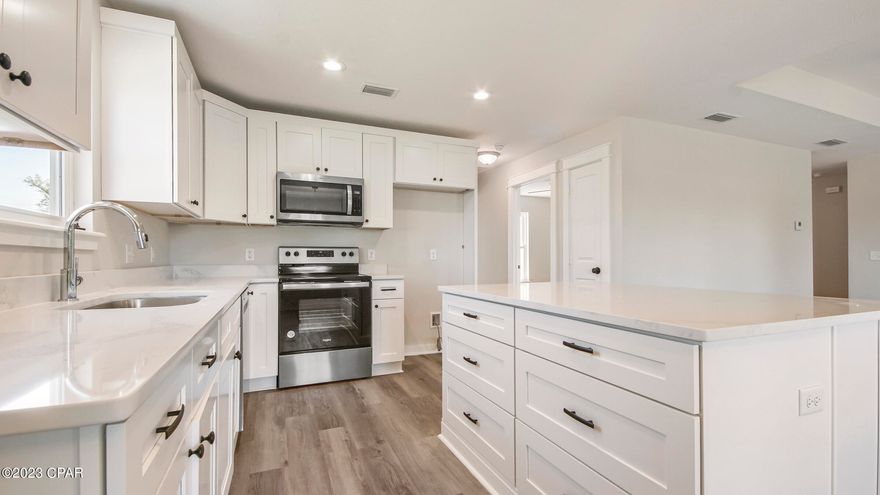 This beautifully newly built home is a 3 bedroom, 2 bath and ready for a new owner. Welcome into this inviting open concept living room and kitchen. With custom cabinets, granite countertops, stainless steal appliances, and a kitchen island perfect for entertaining. Throughout the home is LVP flooring with carpet in the bedrooms. The master bedroom contains a tub/shower combo, and walk in closet with a laundry room leading out to the garage