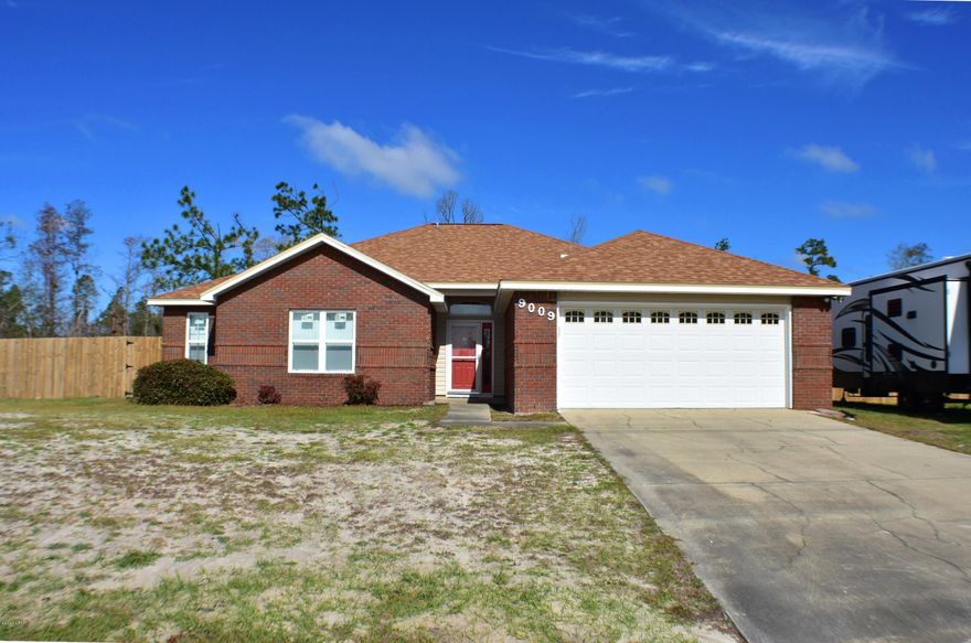 CURRENTLY UNDER CONTRACT, SELLER ACCEPTING BACKUP OFFERS.Practically brand new home in Indian Creek Village! This is a 4-bedroom, 2-bath home with all new roof, windows, screens, fireplace, chimney, walls, insulation, ceilings, paint, siding, &gutters.  The sellers also updated the kitchen cabinets, fence, blinds & had all the broken trees removed from the yard.  Also, the AC, water system & garage door were recently serviced.  All of this means you have a move-in ready home!  The home features wood laminate flooring, a screened-in porch, tray ceiling in the master & a huge backyard that backs up to protected wetlands. There is also 50 amp hookup for an RV.  You're only 10 minutes from town and less than 20 from Tyndall AFB.   All info is approx. and must be verified by Buyers if impor Home has lots of room for your boat, RV, or other toys. Home is protected by a Termite Bond.