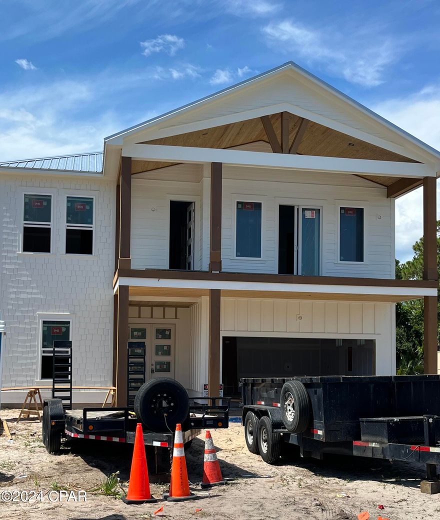 CURRENTLY UNDER CONTRACT SELLER WILL CONSIDER BACK UP OFFERS Coastal living with gulf views.  3050sqft of new construction with 6 bedrooms 5 baths ,2 car garage, heated saltwater swimming pool, no HOA, 10& 11 ft ceilings throughout the home, built energy efficient with metal roof, kitchen is custom built with a 36' gas stove, separate pantry all stainless appliances, quartz tops, baths offer fully tiled showers, custom cabinets with quartz vanity tops, plank vinyl for durable wear on floors. home is scheduled for completion July 31   seller is a Florida realtor