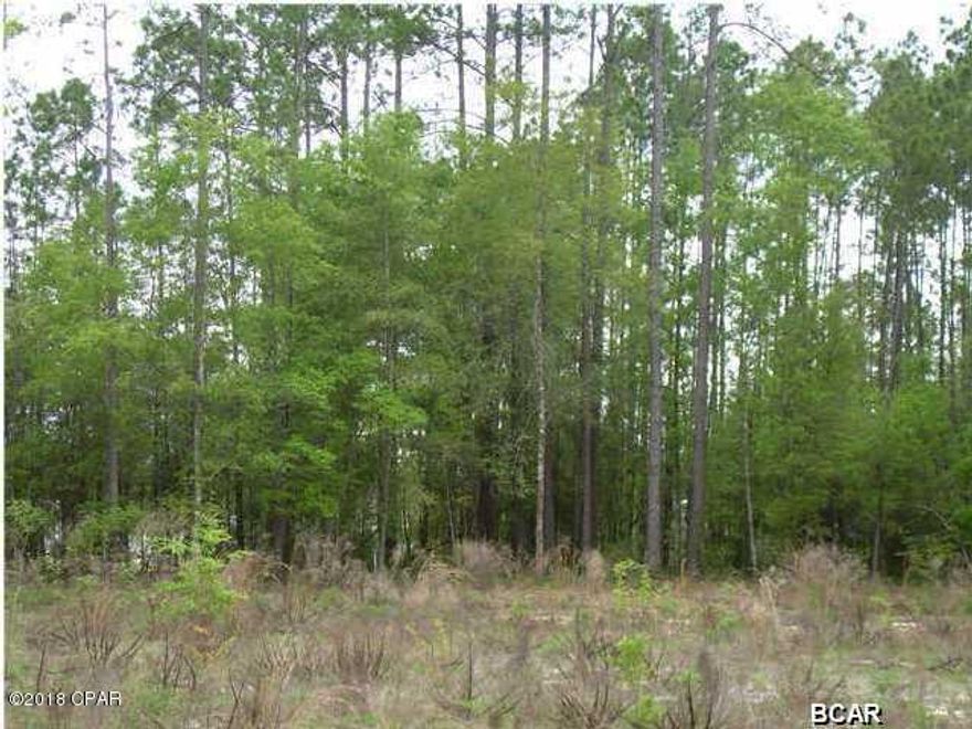 Price reduced on almost an acre of land.