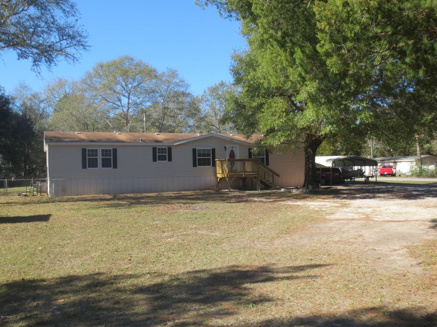 Spacious 3 bedroom 3 full bath home in immaculate condition, located on a large corner lot with lots of mature shade trees. You will love preparing meals in this large 15 X 13 kitchen with breakfast bar, lots of oak cabinets and counter space with a double pantry. Living room has vaulted ceiling with a fireplace and French doors leading out onto a nice wooden deck and fenced in backyard. Home features a 13x25 master bedroom with a shower in his private bathroom and a great whirlpool in her private bathroom. Both master baths are adjoined by a large walk thru closet. There are 2 storage buildings in the fenced in back yard for all your tools and yard equipment, double gates to access the backyard from the Deanne Rd side of the home. Double detached carport for parking your car or boat with access to the property from 2 streets, one of the advantages of owning a Â½ acre corner lot. Call for your private showing today.
