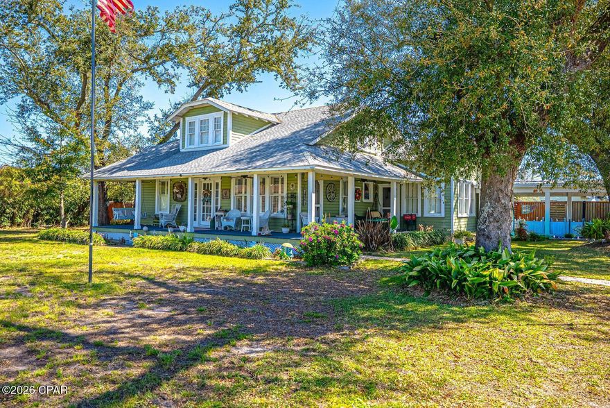 This wonderful historic Florida home sits in the desirable Cove area and only one block from the beach and Beach Drive.  Home is close to  3000 square feet to accommodate a large family. Major renovations were accomplished in 1980 and 2010 with upgraded electrical, new wiring, and plumbing.  A new kitchen with numerous upgrades, large family bonus room added, and other factors.  Home is a 4 bedroom and 4 full bathrooms sitting on over 1/2 of an acre with some water view visibility of the Bay.  The true elegance of this home is indescribable with so much character, history, and personality. Approaching the circular drive way, surrounded by a wrap around porch, you are entering the  elegant entrance and  greeted by original hard wood flooring throughout, thus  encompassing a formal living room and formal dining room.  Large Master bedroom and spacious bathroom all  located on the 1st floor.  Also on the 1st floor is a guest bedroom.  The large kitchen has been fully upgraded with stainless steel appliances, granite counter and breakfast bar.. Kitchen overlooks the Family Room which is surrounded by numerous windows giving natural lighting throughout . Ample pantry and laundry room.  You have a large spacious bonus room that can by used as an office, play room, game room or another Family room.  Walking up the second floor, you have two large bedrooms and two additional full bathrooms.  The exterior is beautifully landscaped with a circular driveway for your parking needs.  You have  a beautiful fenced in back yard,  A workshop, garage and room for a golf cart gives you plenty of room for parking to include a RV.. This large home combines timeless comfort and close proximity to the beach, schools, shopping, fine restaurants in the  St Andrew area.